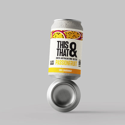 Two cans of This & That Wine Seltzer  passionfruit flavour stacked on top of each-other on a grey background